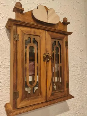 a wooden cabinet with a heart on top of it at Athens Riviera apt with seaview, 15' to Acropolis in Athens