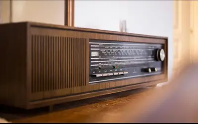 an old television is sitting on the floor at A litte Taste of Home Guest House in Athens