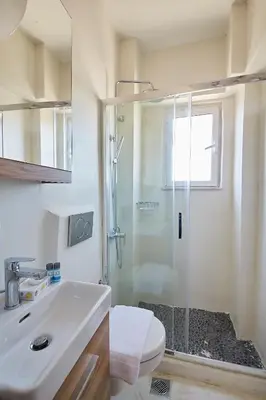 a bathroom with a shower and a toilet and a sink at toStay-Unique apartment hotel in Athens center! in Athens