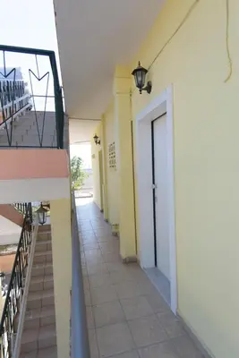an empty hallway of a building with a door at Andriana' s apartment Agia Paraskevi in Athens