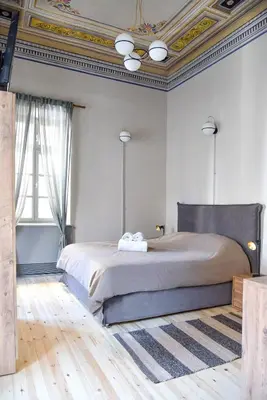 a bedroom with a large bed with a coffered ceiling at Erst Guest House in Athens