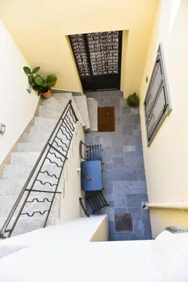 an overhead view of a staircase in a house at Erst Guest House in Athens