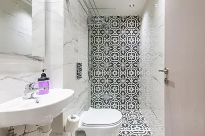 a white bathroom with a toilet and a sink at Filia Place in Athens