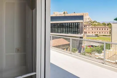a balcony with a view of a building at Acropolitana Grand view veranda in Athens