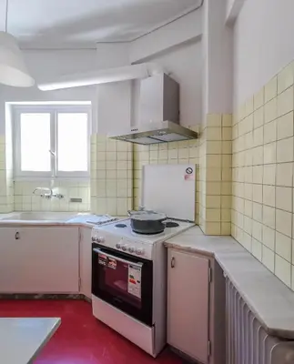 a small kitchen with a stove and a sink at Acropolitana Grand view veranda in Athens