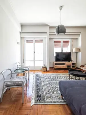 a living room with a couch and a tv at Acropolitana Grand view veranda in Athens