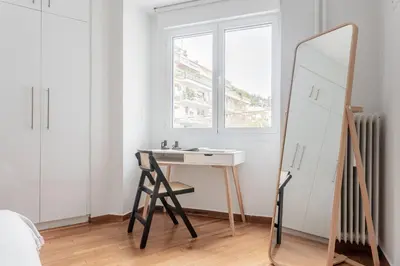 a bathroom with a dressing table and a mirror at Charming & Comfy 2BD Apartment in Acropolis Area by UPSTREET in Athens