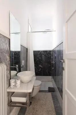 a bathroom with a sink and a toilet and a shower at Plaka Two-Storey Penhouse with Acropolis Views PL6 in Athens