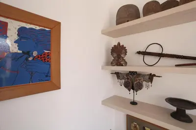 a room with shelves and a painting on the wall at Plaka Two-Storey Penhouse with Acropolis Views PL6 in Athens