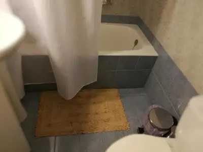 a bathroom with a bath tub and a sink at Platos Academy Apartment in Athens