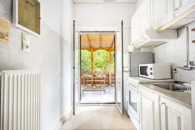 a kitchen with a sink and a microwave at Cozy Studio in Central Glyfada in Athens