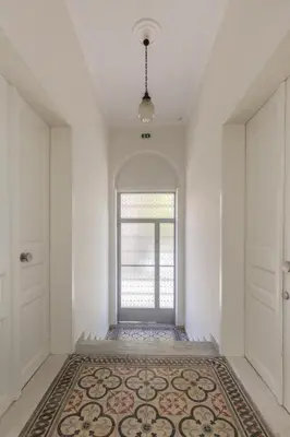 an empty hallway with a door and a rug at Troon of Athens Apartments in Athens