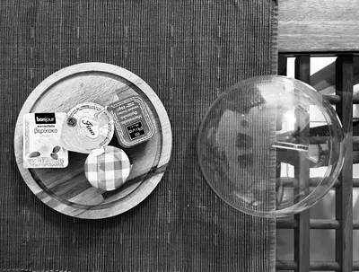 a plate of food on a table next to a glass at Elenis Athens Apartment in Athens