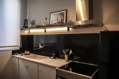 a kitchen with a sink and a stove at API Projects Athens - Cartier Apartment in Athens