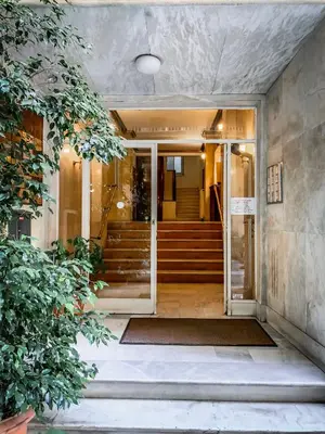 an entrance to a building with a glass door at API Projects Athens - Cartier Apartment in Athens