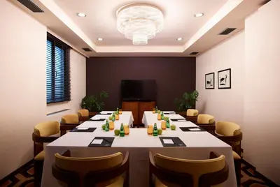a conference room with a long table and chairs at Brown Acropol, a member of Brown Hotels in Athens