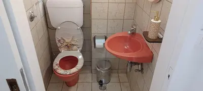 a small bathroom with a toilet and a sink at Cosy apartment in Chalandri in Athens