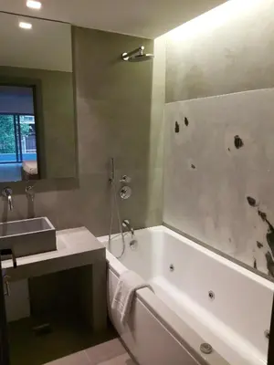 a bathroom with a bath tub and a sink and a bath tub at The Link Athens in Athens