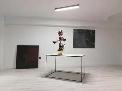 a table with a plant on it in a room at The Link Athens in Athens