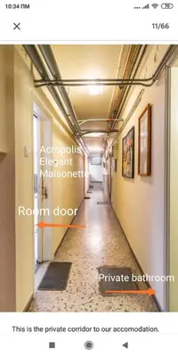 a hallway in a building with a room door at Acropolis Elegant Maisonette by LODGESPOT in Athens