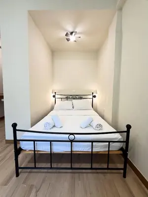 a small bedroom with a bed in a room at AS Modern Monastiraki Apartment 1A in Athens