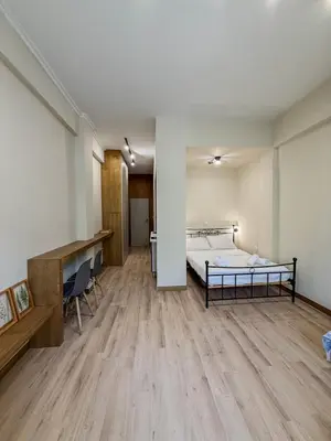 a room with a bed and a desk in it at AS Modern Monastiraki Apartment 1A in Athens