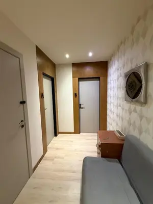 a living room with a couch and a table at AS Modern Monastiraki Apartment 1A in Athens