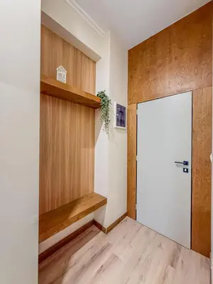 a room with a white door and a wooden shelf at AS Modern Monastiraki Apartment 1A in Athens