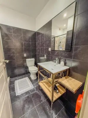 a bathroom with a sink and a toilet at AS Modern Monastiraki Apartment 1A in Athens