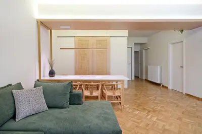 a living room with a couch and a table at The Fancy Philosopher Apartment in Athens