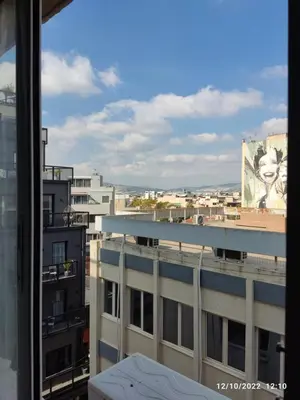 a view of a city from a window at COZY Studio, Athens city center in Athens