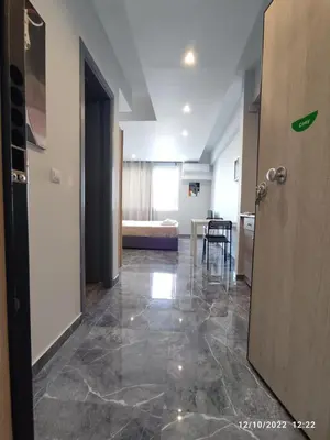 a hallway with a room with a table and a door at COZY Studio, Athens city center in Athens
