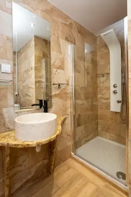 a bathroom with a sink and a shower at Eclectic 4-Bed, 4-Bath Apt in Central Athens - AK1 in Athens