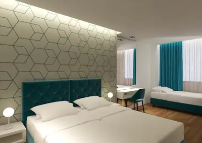 a bedroom with a large bed and a desk at Athenian Montaza Hotel in Athens