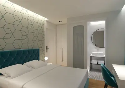 a bedroom with a bed and a mirror and a sink at Athenian Montaza Hotel in Athens
