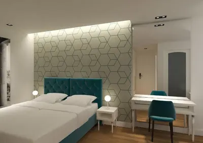 a bedroom with a bed and a desk and a chair at Athenian Montaza Hotel in Athens