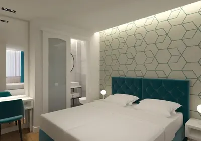 a bedroom with a large bed with a blue headboard at Athenian Montaza Hotel in Athens
