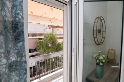 a window with a view of a balcony at Best House, Anakreontos, Perivolaki, Nikaia, P... in Piraeus