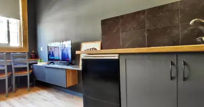 a kitchen with a black refrigerator and a desk at AS Athens Central Cozy Apartment 2 in Athens