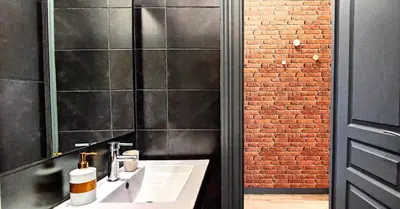 a bathroom with a sink and a black wall at AS Athens Central Cozy Apartment 2 in Athens