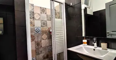 a bathroom with a sink and a mirror at AS Athens Central Cozy Apartment 2 in Athens