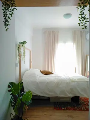 a bedroom with a white bed and a window at White Tundra Studio in Athens