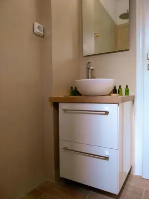 a bathroom with a sink and a mirror at White Tundra Studio in Athens