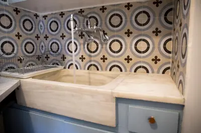 a bathroom with a wooden sink with a faucet at Sunny Top Floor Studio - Excellent Athens view in Athens