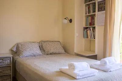 a bedroom with a bed with towels on it at Sunny Top Floor Studio - Excellent Athens view in Athens