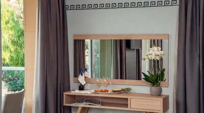 a dressing table with a mirror in a room at Hotel Thissio in Athens