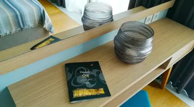 a table with two baskets and a book on it at Hotel Thissio in Athens
