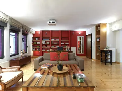 a living room with a couch and a table at Koukaki garden escape child friendly apartment in Athens