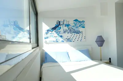 a bedroom with a bed and a window at STUDIO ANASTASIA in Athens