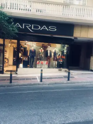 a store with a mannequins in a store window at Aris Apartment in Athens